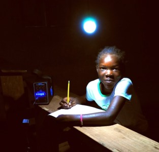 A child using an energy kiosk in Kenya