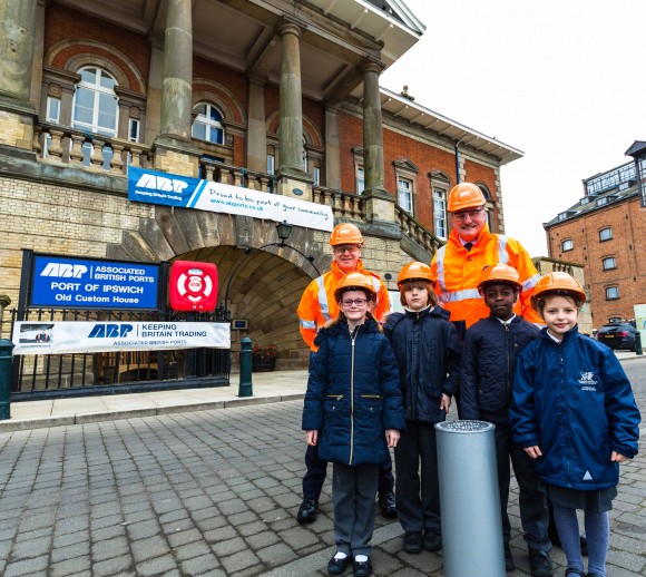 Children from St Mark's Catholic Primary School who were involved making items that were placed inside the time capsule are pictured with Andrew Harston (back right) Director of Shortsea Ports, Associated British Ports and Ben Gummer MP, together with the time capsule ahead of it being lifted to the clock tower of ABP's Old Custom House, Suffolk, United Kingdom on 18-March-2016.