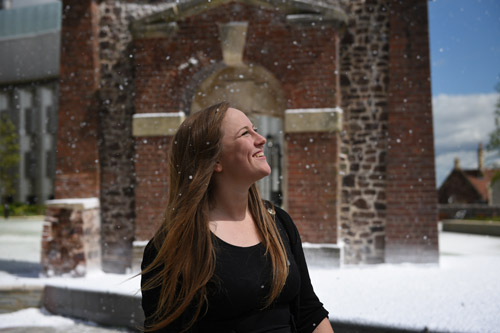 Student Lizzie Mould in the snow she created for Snow Business