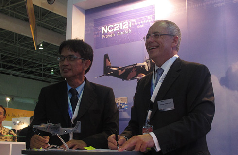 Airbus Military and PT Dirgantara Indonesia (PT DI) have signed an agreement covering the development plan for the NC212i light utility transport aircraft. The agreement, signed at the LIMA Airshow in Langkawi, Malaysia by PT DI CEO Budi Santoso and Airbus Military CEO Domingo Ureña-Raso (see photo), ratifies and details the joint development, manufacturing, commercialisation and support workpackages for the new NC212i launched in November 2012. (c) Airbus Military