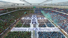 More than 30,000 employees came to the BayArena to celebrate Bayer's 150th anniversary, forming the largest-ever human Bayer cross.