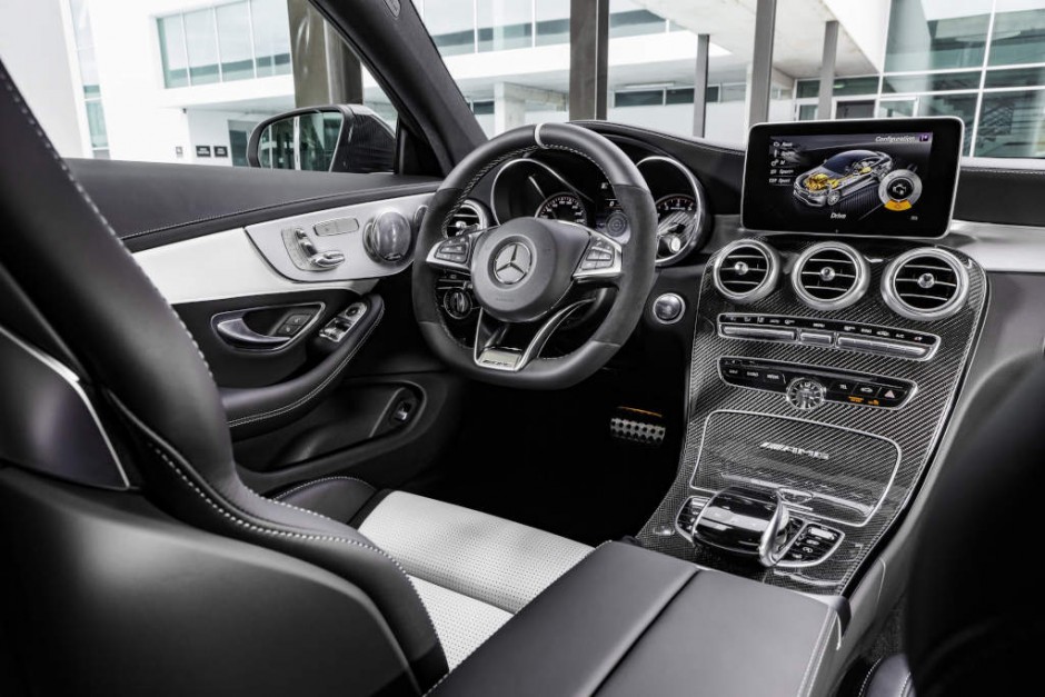 Mercedes-AMG C 63 S Coupé, interior: leather crystal grey/black, AMG Performance steering wheel in black nappa leather/DINAMICA microfibre in a 3-spoke design, with flattened bottom section, 12 o'clock marking in black, steering wheel bezel in silver chrome with "AMG" lettering and silver-coloured aluminium shift paddles, AMG carbon-fibre/light longitudinal-grain aluminum trim