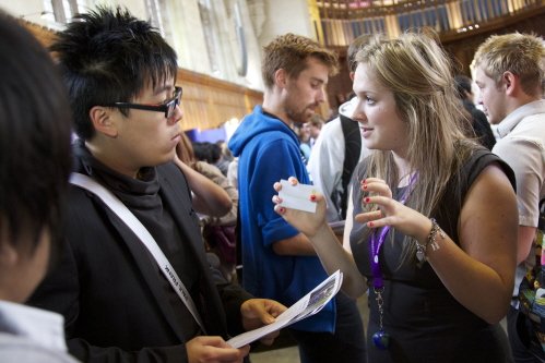 Students and employers at a careers fair in the Great Hall of the Wills Building