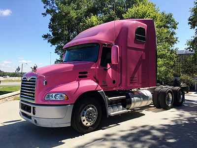 Mack Trucks with pink Mack® Pinnacle™ axle back model during breast cancer awareness month